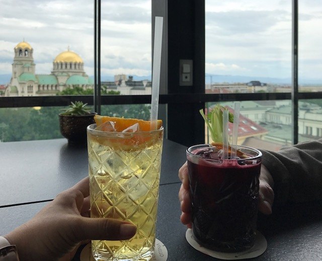 enjoying cocktail with a view at sense hotel